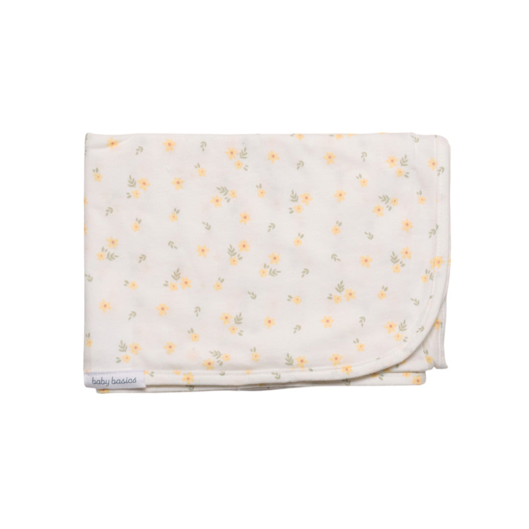 Floral patterned baby swaddle blanket on a white background