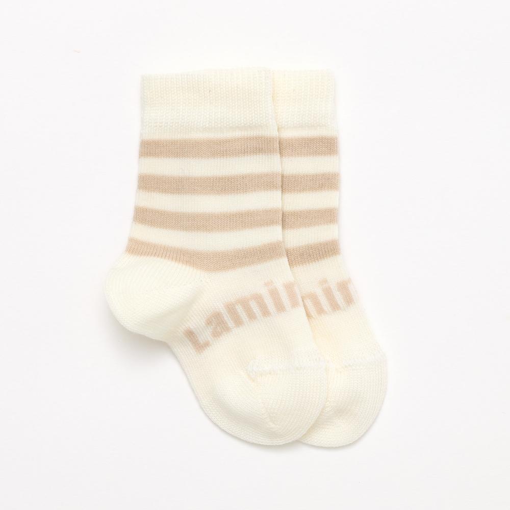 White and beige baby crew merino socks on a white background