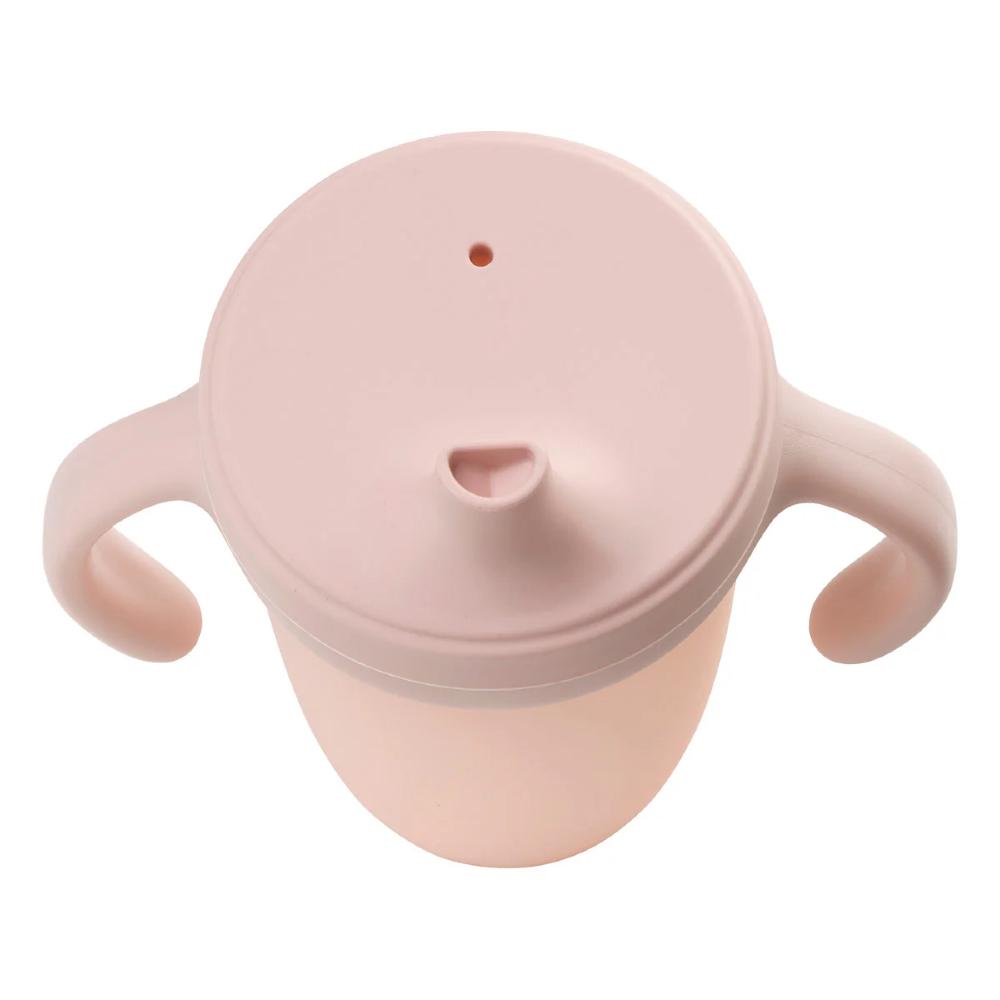 Pink sippy cup with handles on a white background