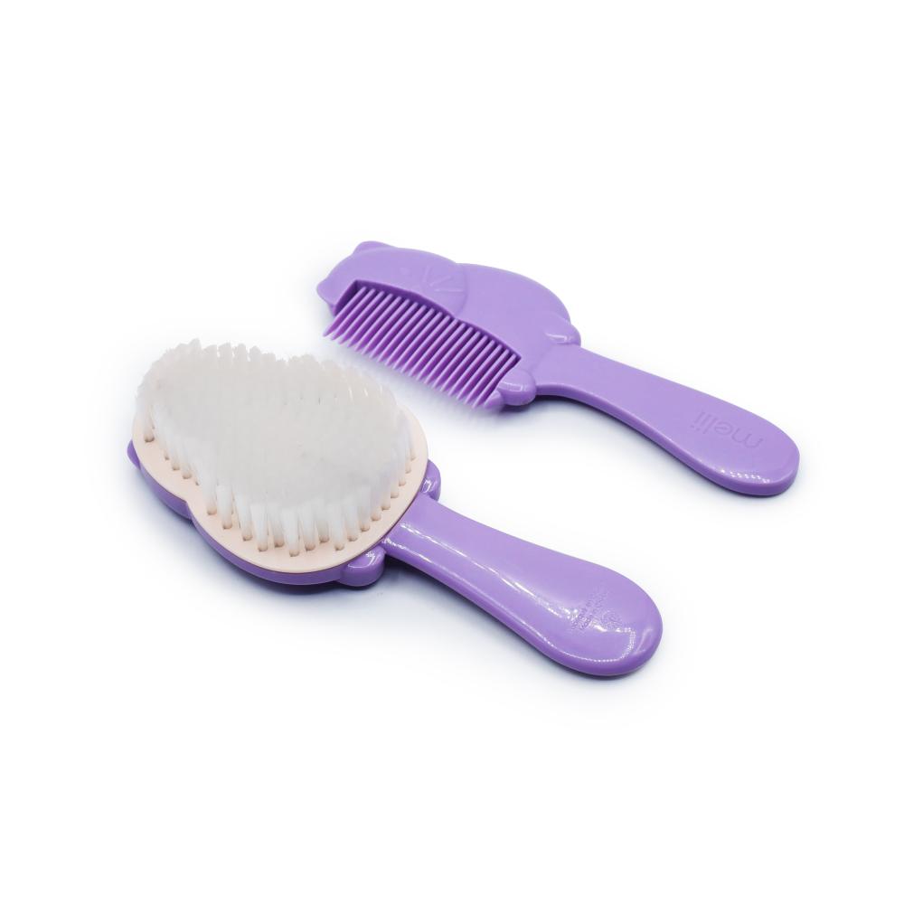 Purple pet grooming brush and comb set on a white background