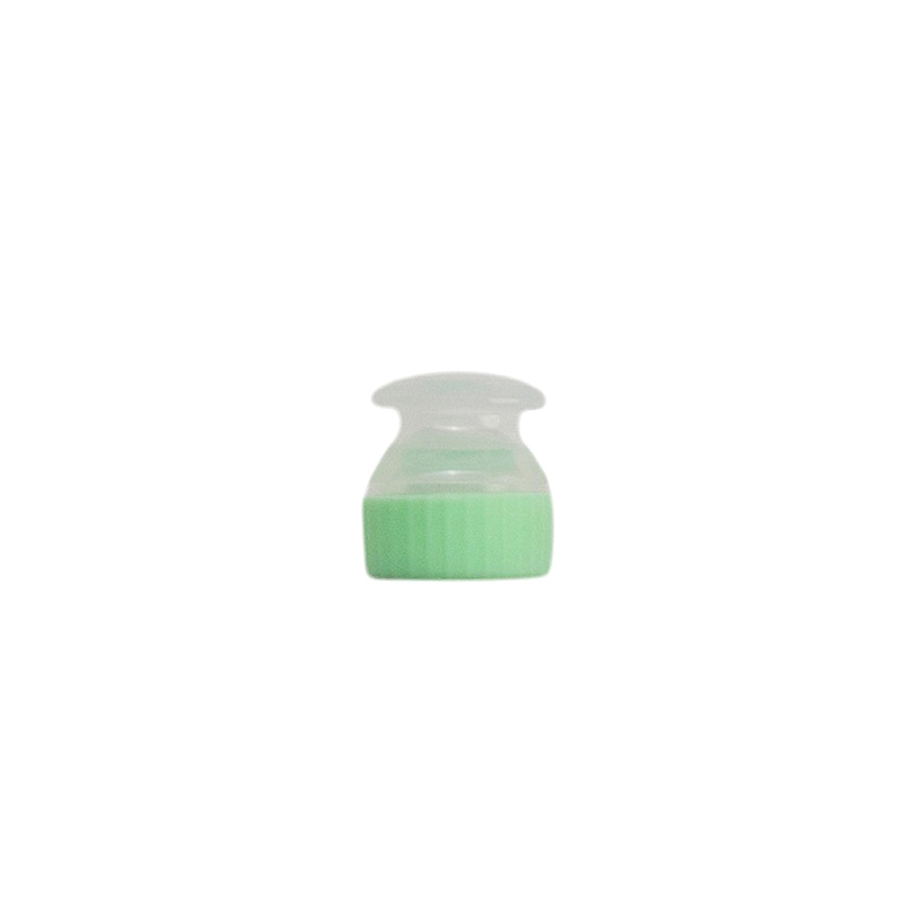 Small green and clear container on a white background