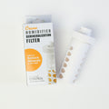Humidifier demineralisation filter packaging with a filter on a white background