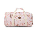 A pink duffel bag with an allover horse print, featuring cream-colored handles and trim, and a circular wooden brand emblem on the front pocket.