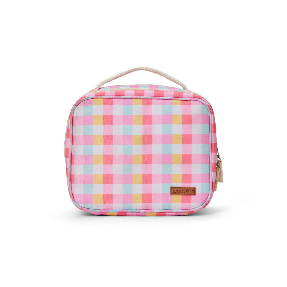 A pink, yellow, and light blue gingham patterned lunch bag with a beige handle and a small brown brand patch on the front, shown on a white background.