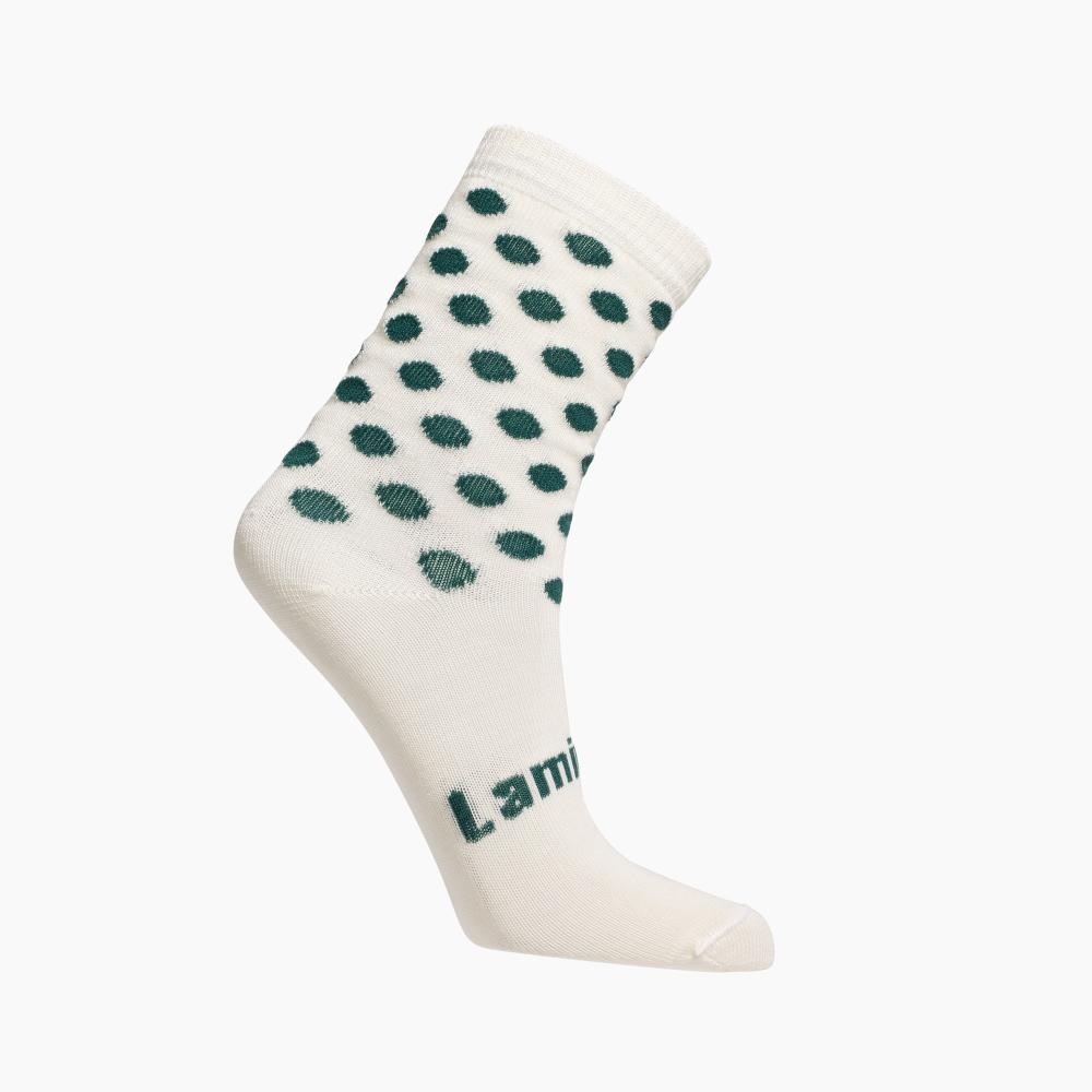White socks with green spots on a white background