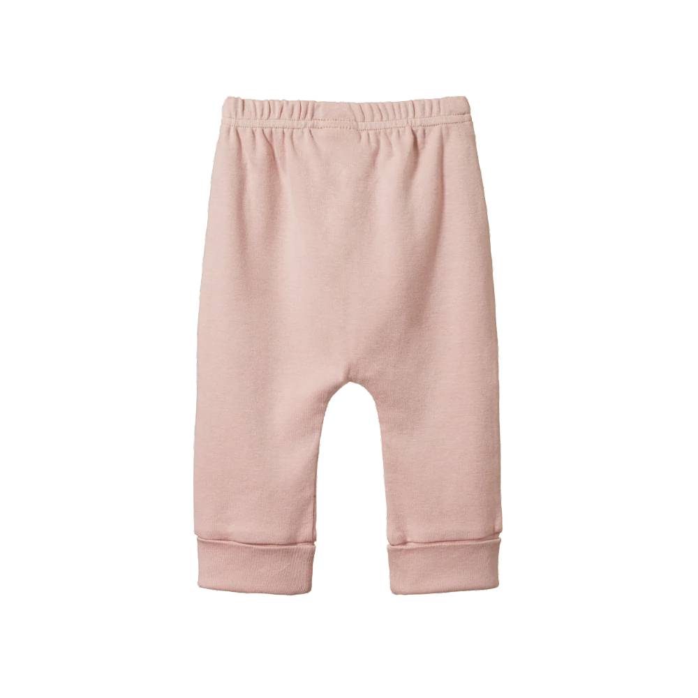 Rose pink cotton baby pants on a white background