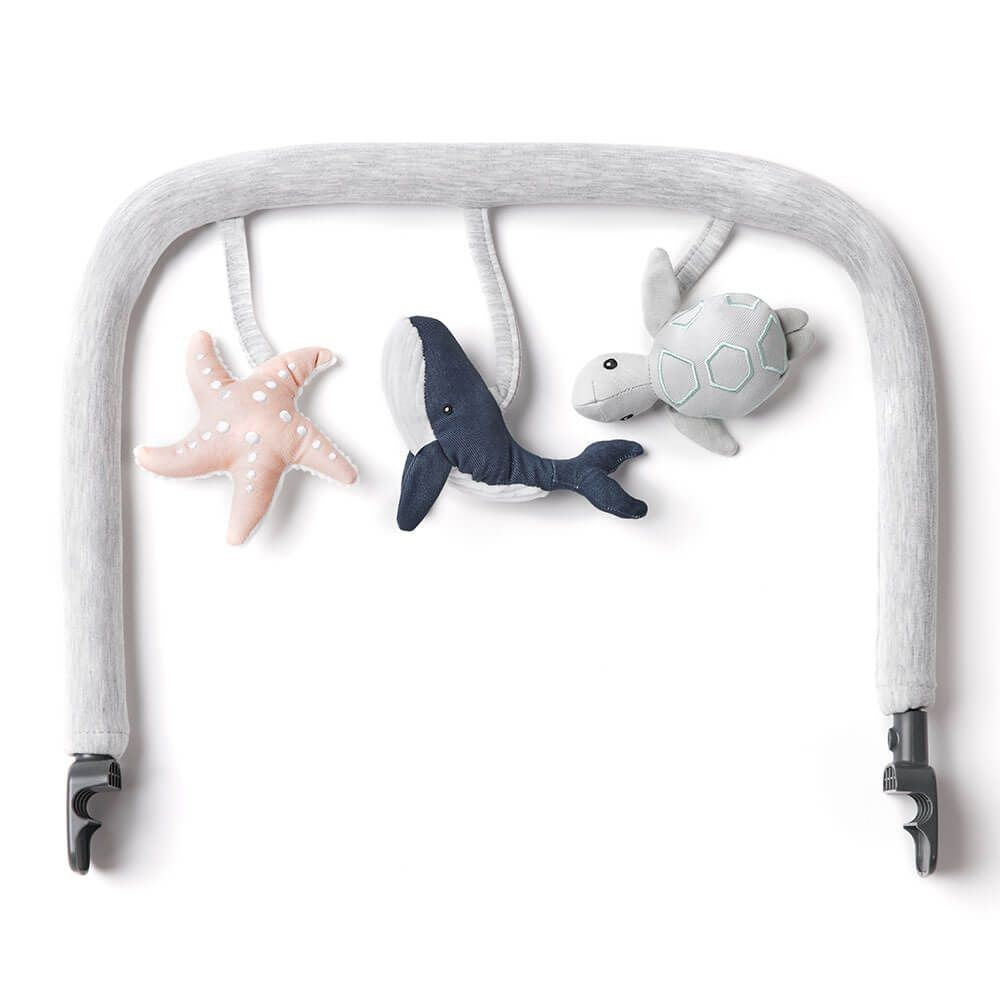 Baby play gym with shark, turtle, and starfish toys on a white background