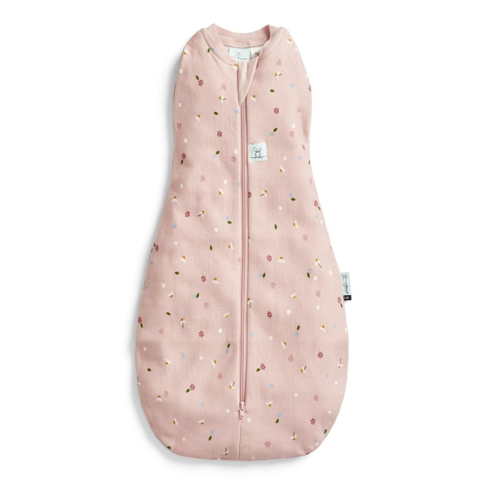 Pink baby sleeping bag with floral pattern on a white background