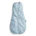 Light blue baby sleeping bag with zip and subtle pattern on a white background