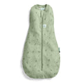 Green baby swaddle sleeping bag with leaf pattern on a white background
