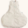 Beige baby sleeping bag with a zipper on a white background