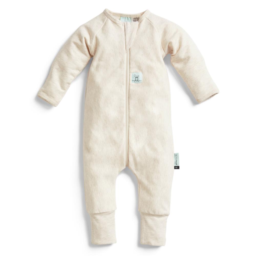 Beige baby onesie with a zipper on a white background