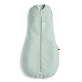 Light green baby prem swaddle with star pattern on a white background