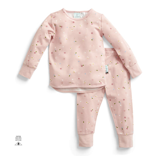 Pink children's pajama set with small patterns on a white background