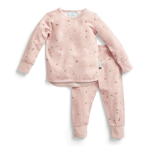 Pink children's pajama set with small patterns on a white background