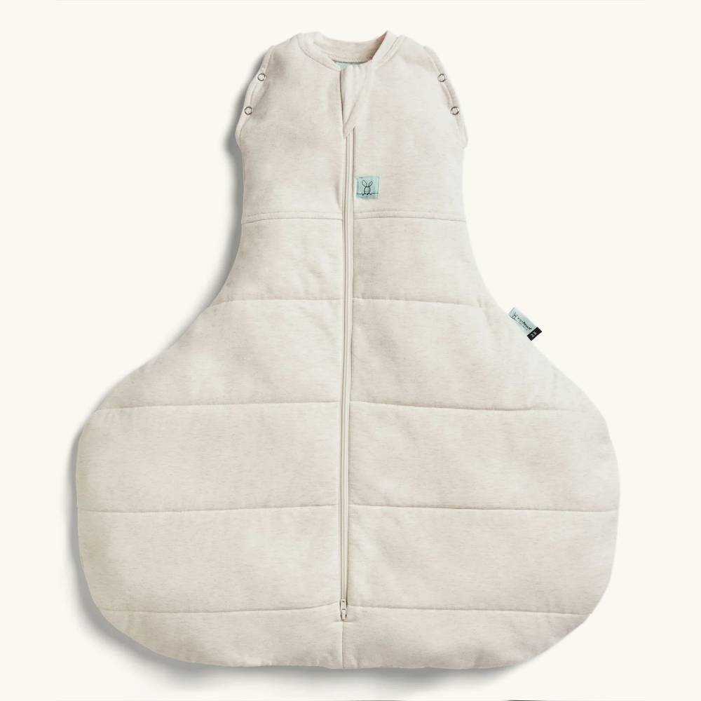 Beige hip friendly wide baby swaddle bag on a white background