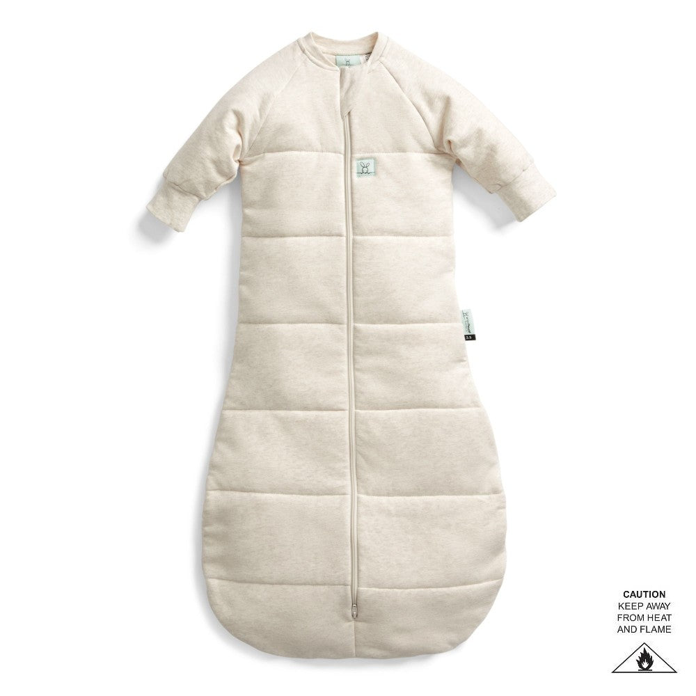 Beige baby sleeping bag on a white background with a caution label.