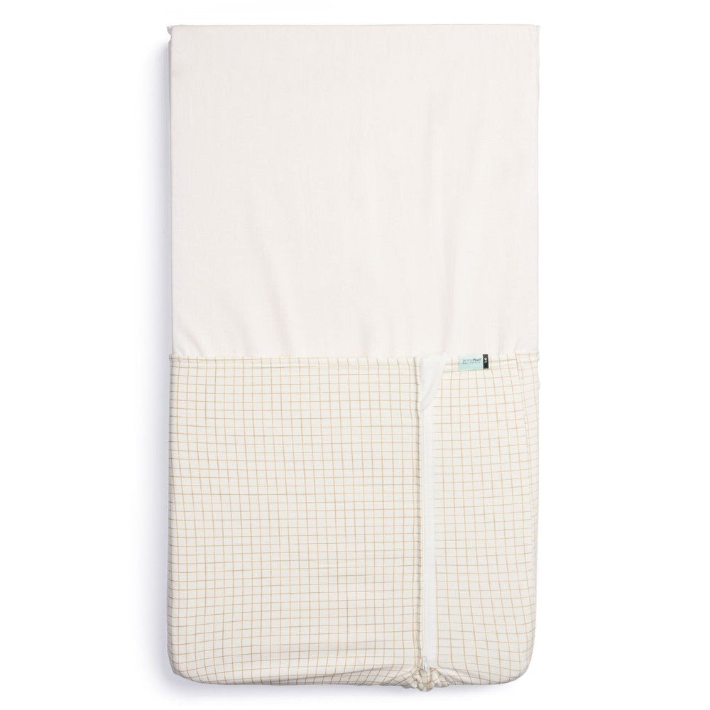 HugMe Blanket in Caramel grid pattern on a mattress on white background
