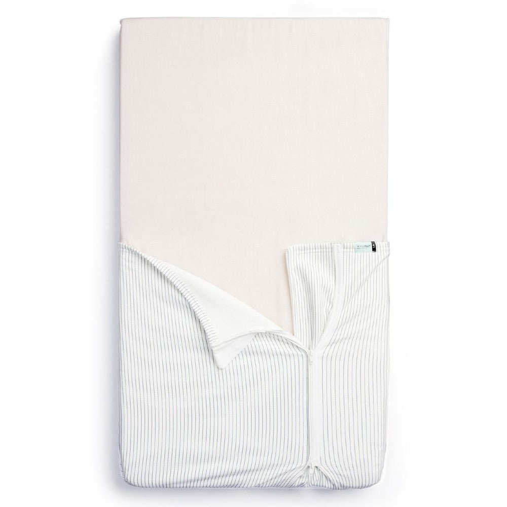 HugMe Blanket in Midnight Stripe pattern on a mattress on white background
