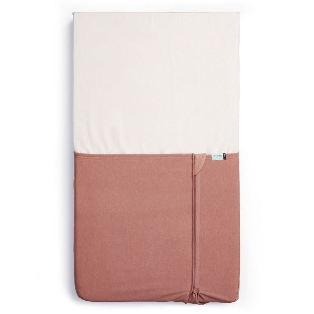 HugMe Blanket in Rose pattern on a mattress on white background