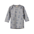 Grey merino long-sleeve shirt with blue dog pattern and envelope neckline on a white background