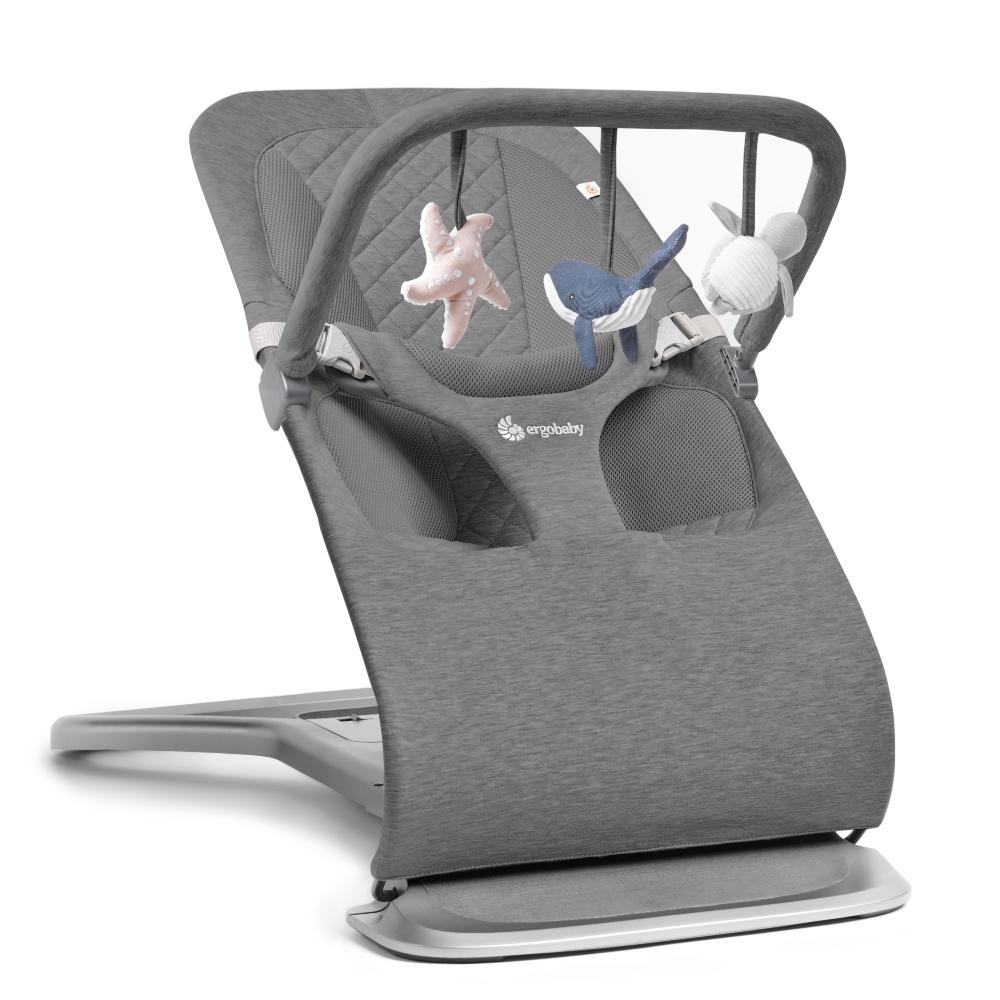 Gray baby bouncer with toys on a white background