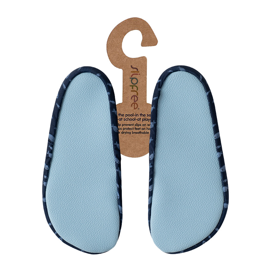 Pair of light blue shoe inserts with dark blue edges and a wooden hanger on a white background