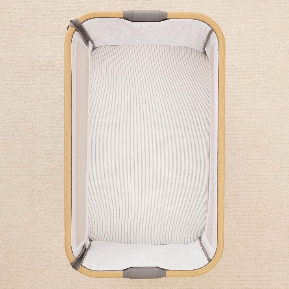 A waterproof fitted sheet shown on a mattress in Midnight Stripe pattern