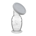 haakaa silicone breast pump with grey cap against a white background 