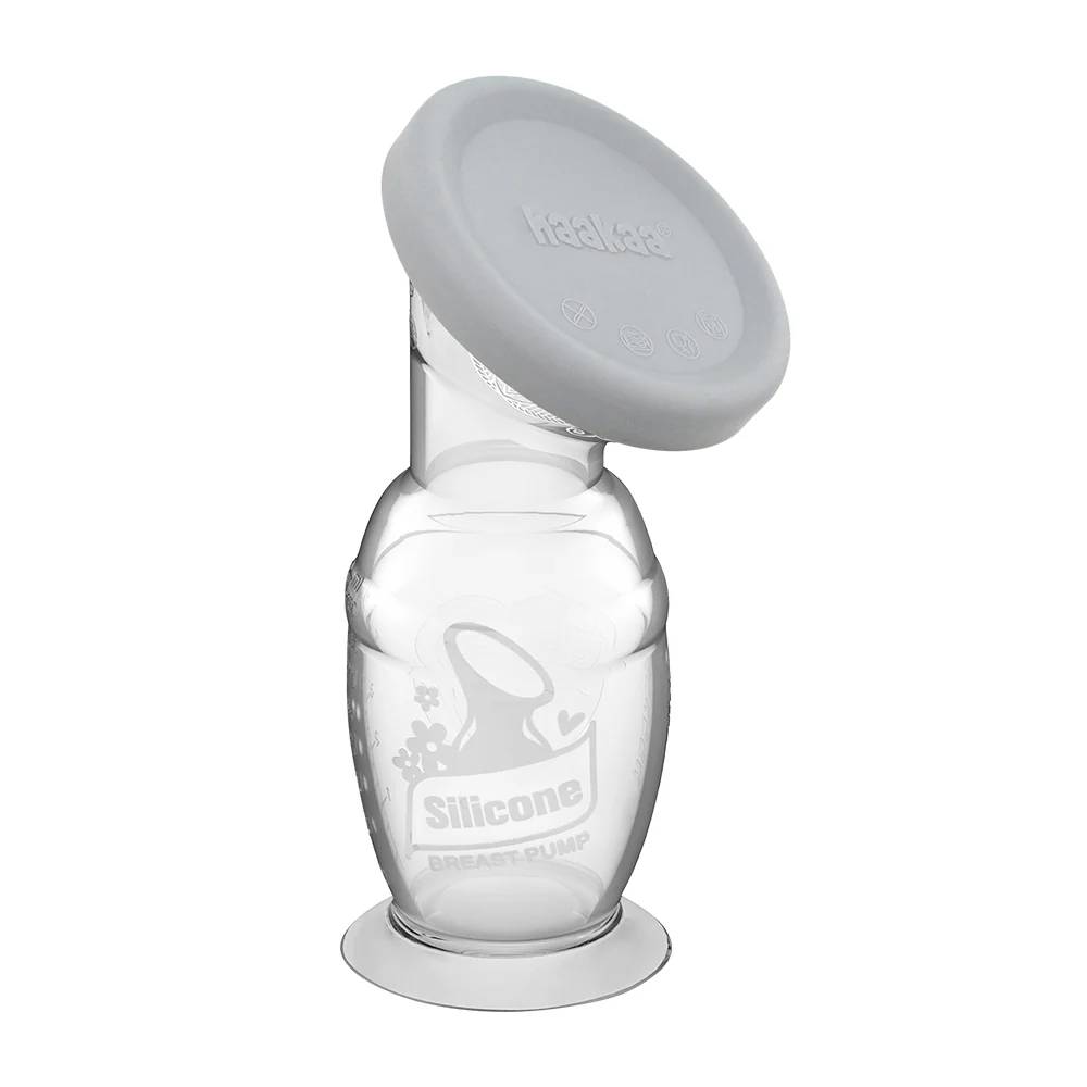 haakaa silicone breast pump with grey cap against a white background 