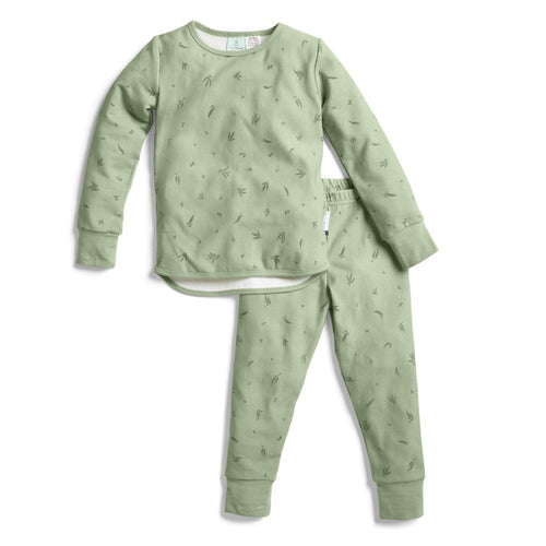 Green pajama set with subtle pattern on a white background