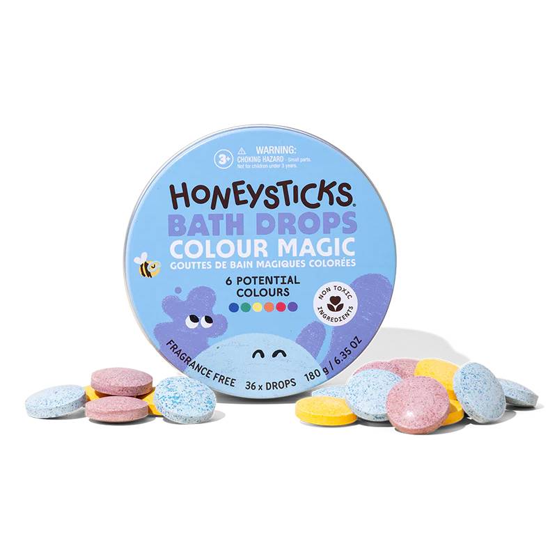 Honeysticks rainbow bath drops against white background.