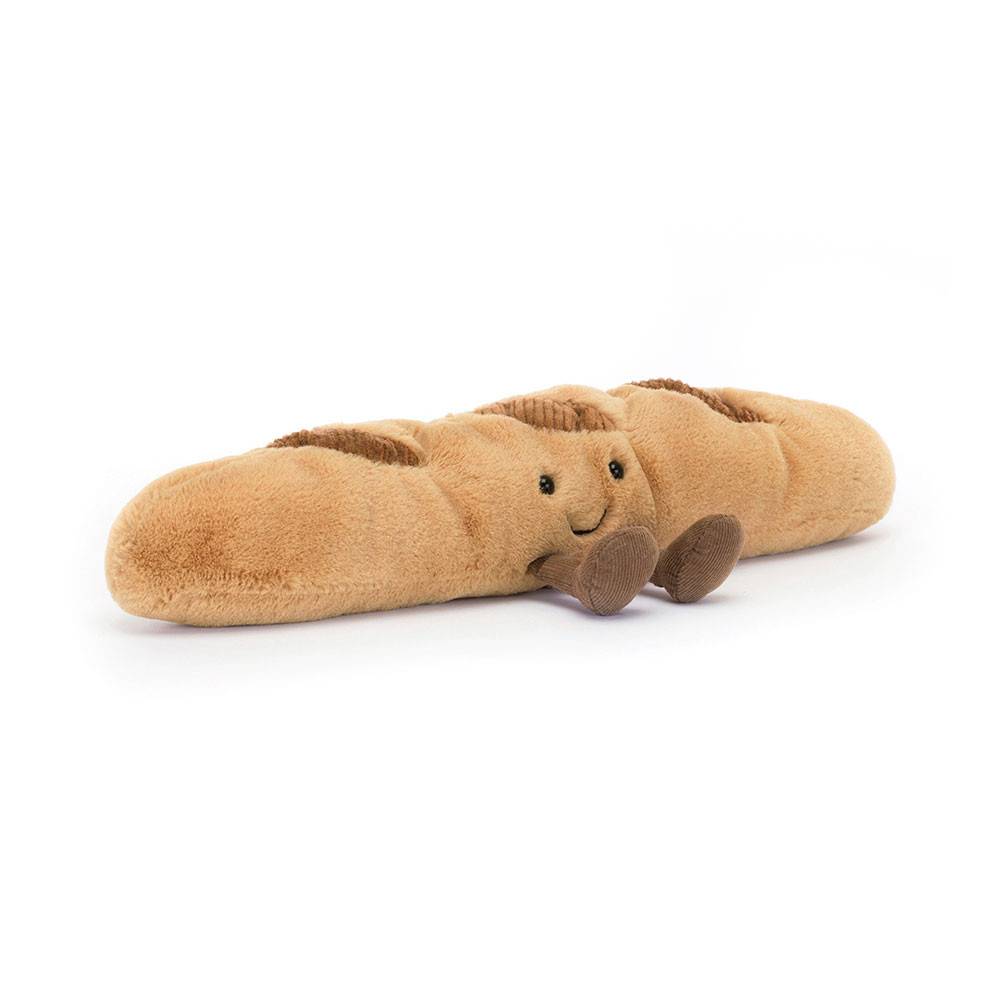 Jellycat cream and brown colored baguette soft toy against white background.