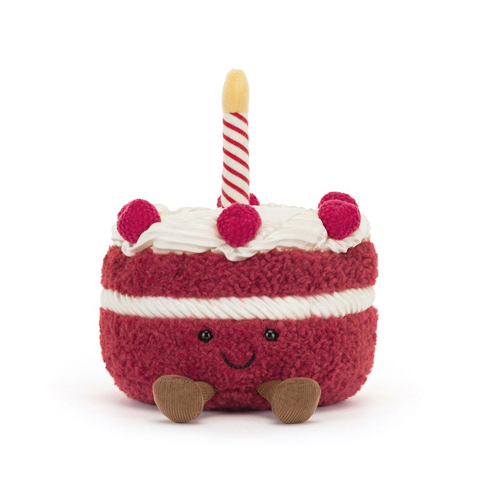 Red Jellycat cake soft toy against white background.