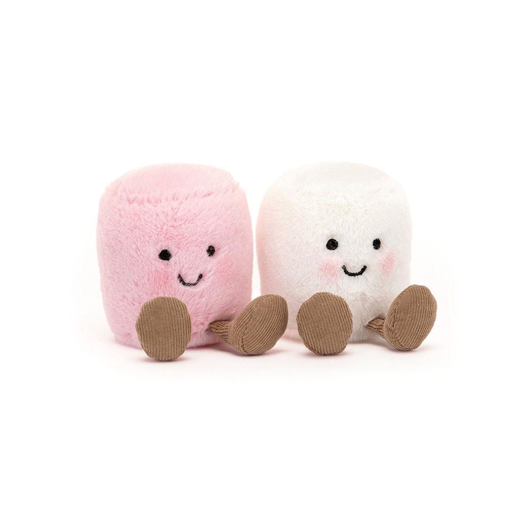 Two cute plush marshmallows side by side on a white background. The left marshmallow is light pink with a black embroidered smiley face and brown feet.