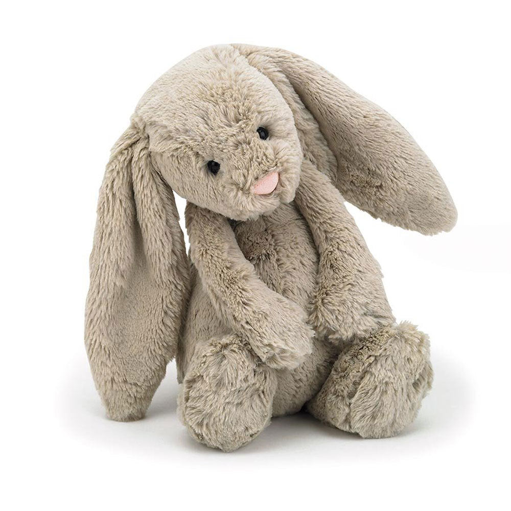 Beige Jellycat bunny soft toy against white background.