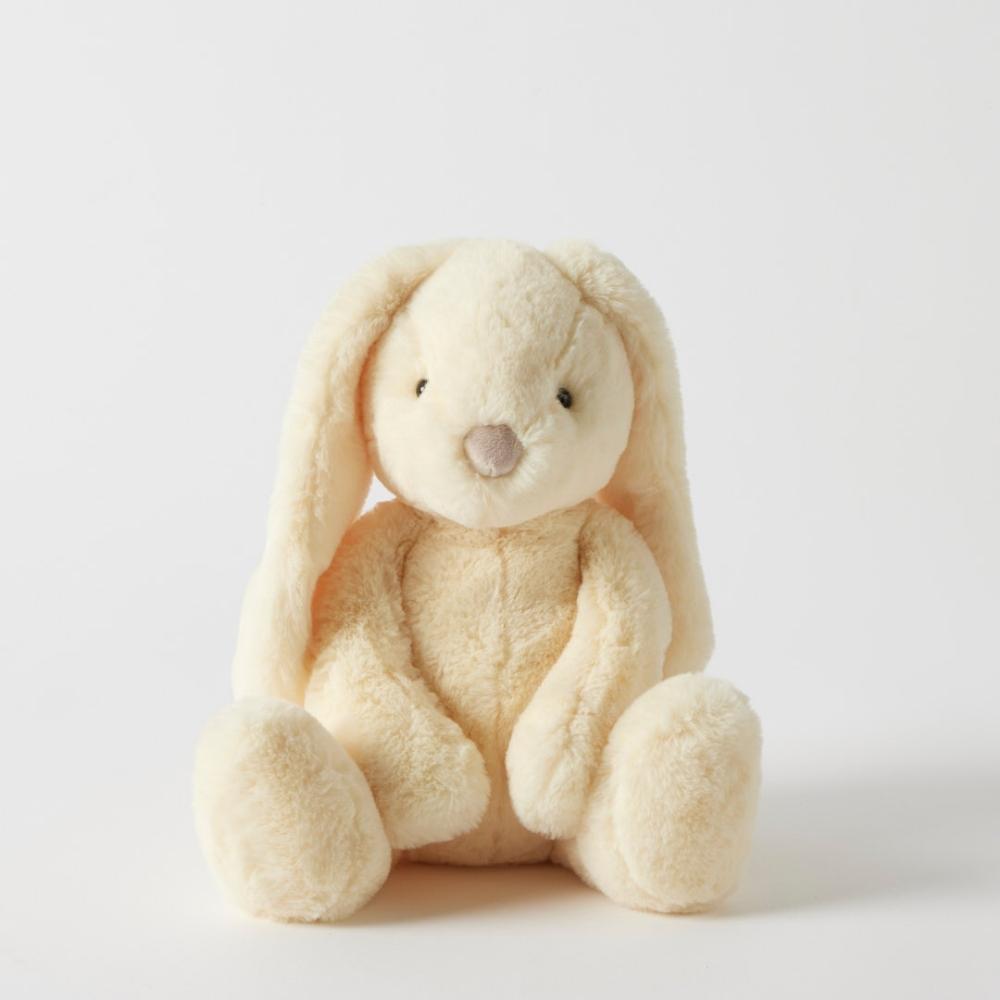 Cream-colored plush bunny toy on a white background