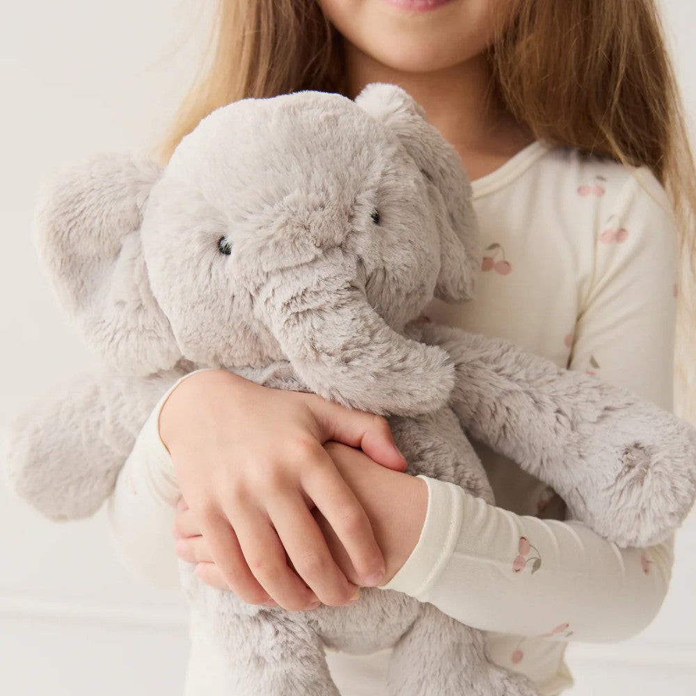 Child holding Jamie Kay grey elephant soft toy.