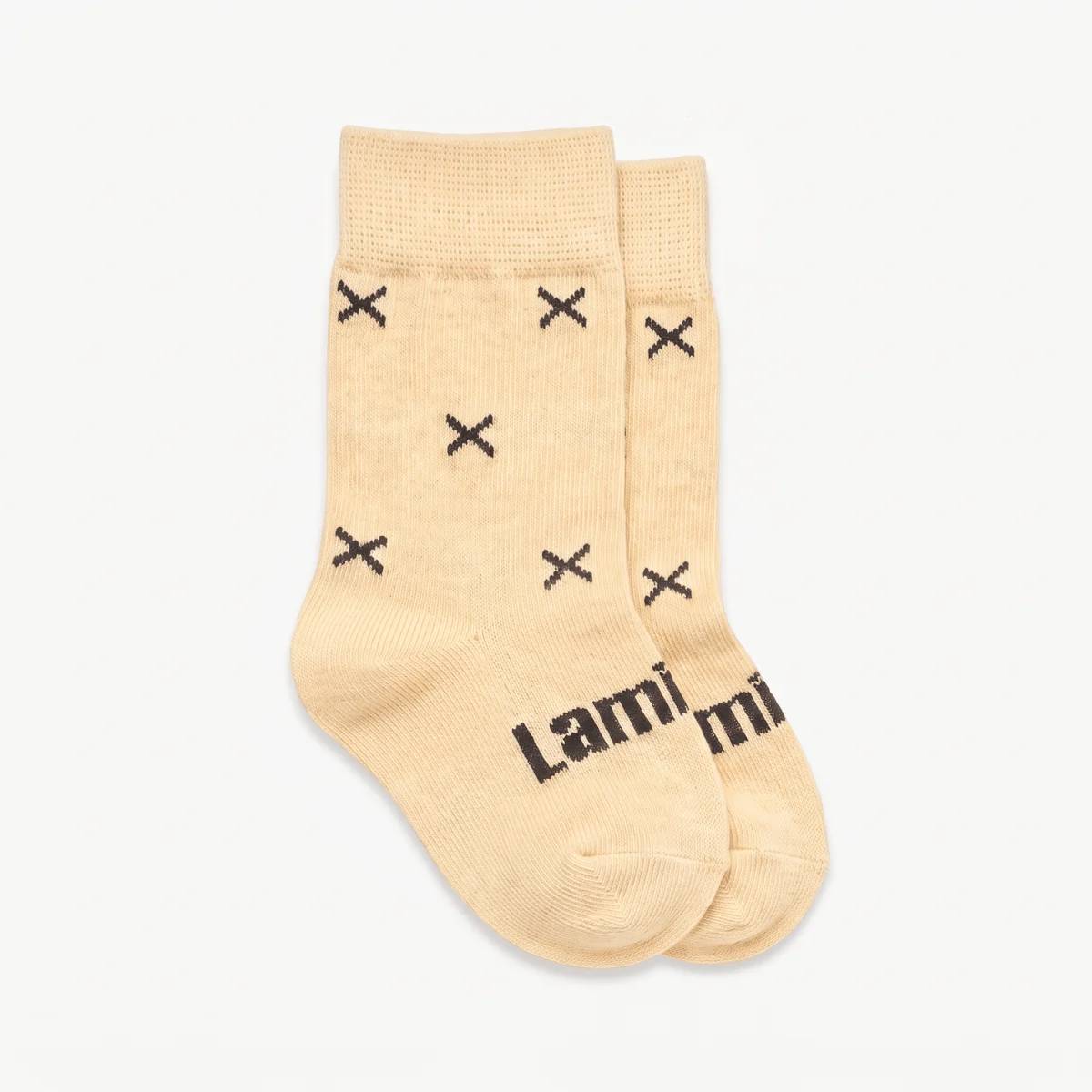 Merino baby crew socks, beige with dark brown crosses on a white background. 