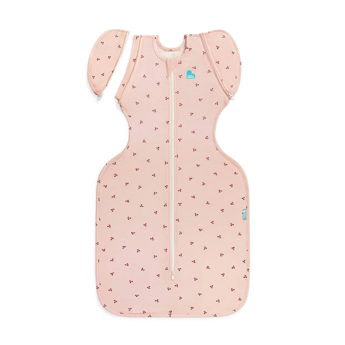 A pink transition fitted swaddle with an all over cherries print on a white background. 