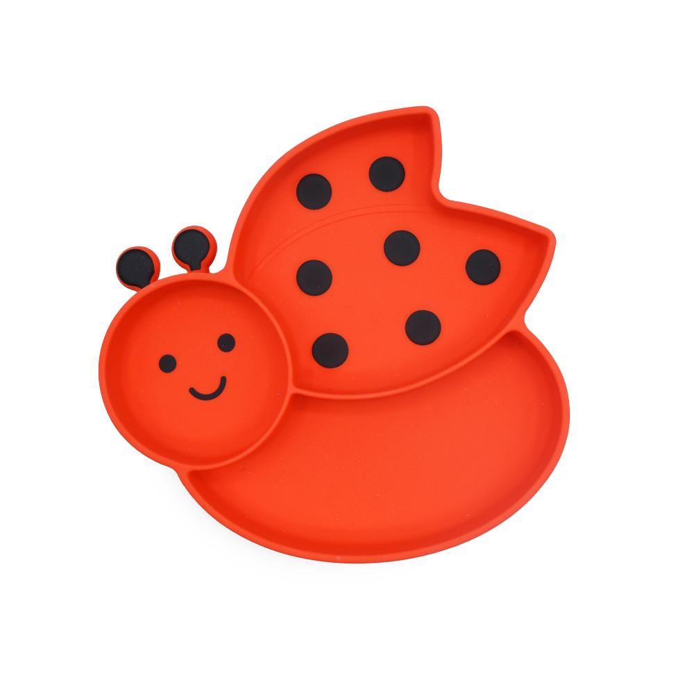 Red ladybug-shaped silicone divided plate on white background