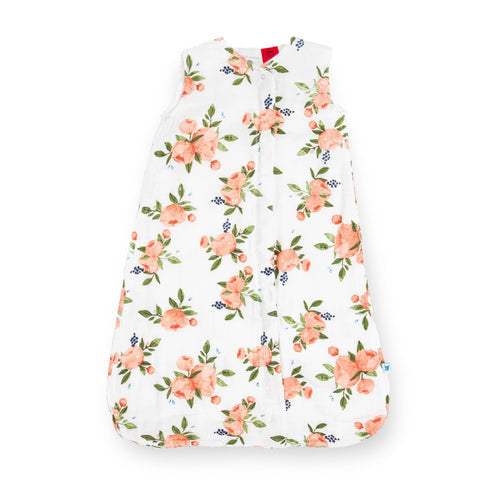White and floral-patterned cotton muslin baby sleeping bag without sleeves on a white background