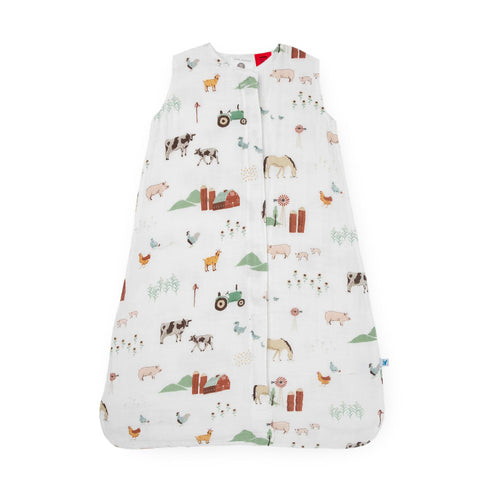 White cotton muslin sleeping bag with farm animal pattern on a white background