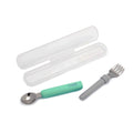 Set of spoon and fork with a white case on a white background, featuring the brand 'melli'.