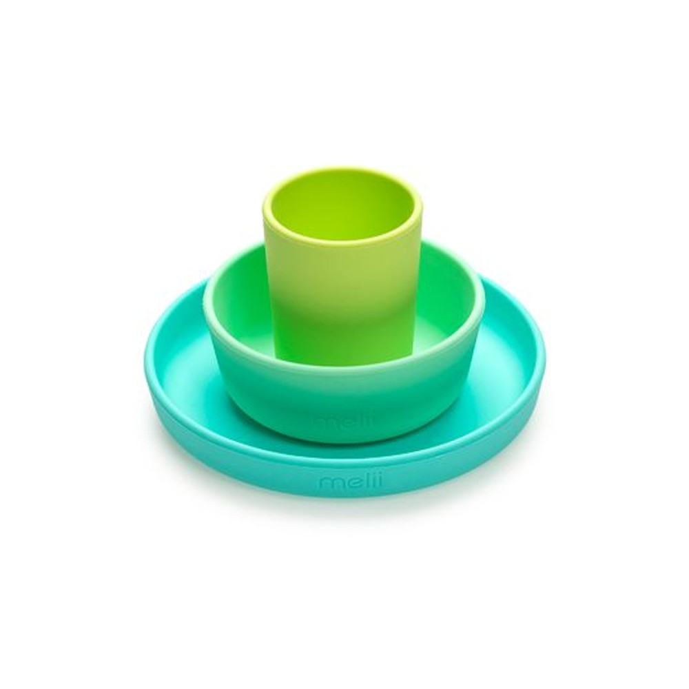Set of green and turquoise silicone dishes on a white background