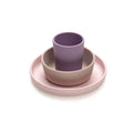 Set of pink and purple silicone dishes with 'meli' branding on a white background