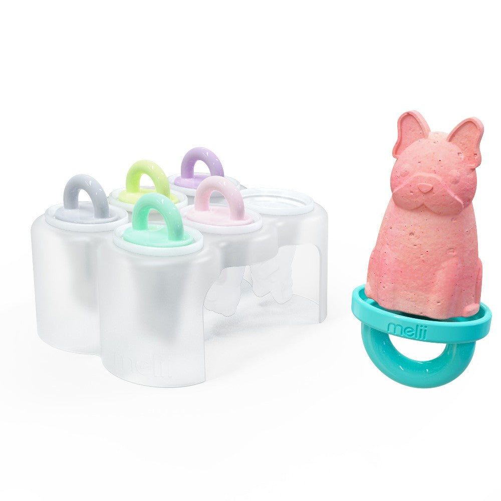Set of colorful popsicle molds with a pink dog-shaped mold on a white background