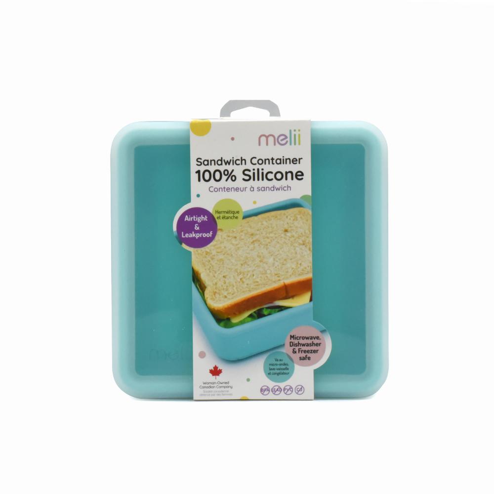 Teal silicone sandwich container with packaging on a white background