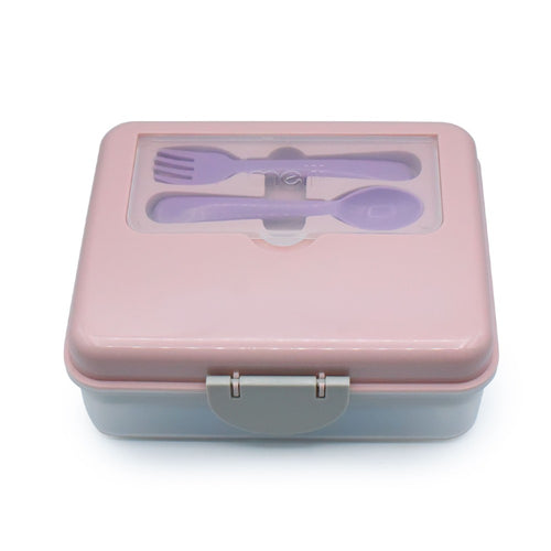 Pink lunch box with cutlery set on a white background