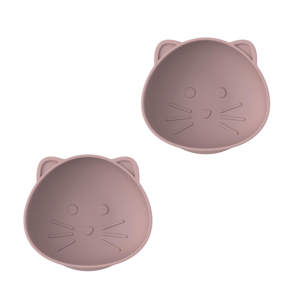 Two pink silicone cat face suction bowls on a white background